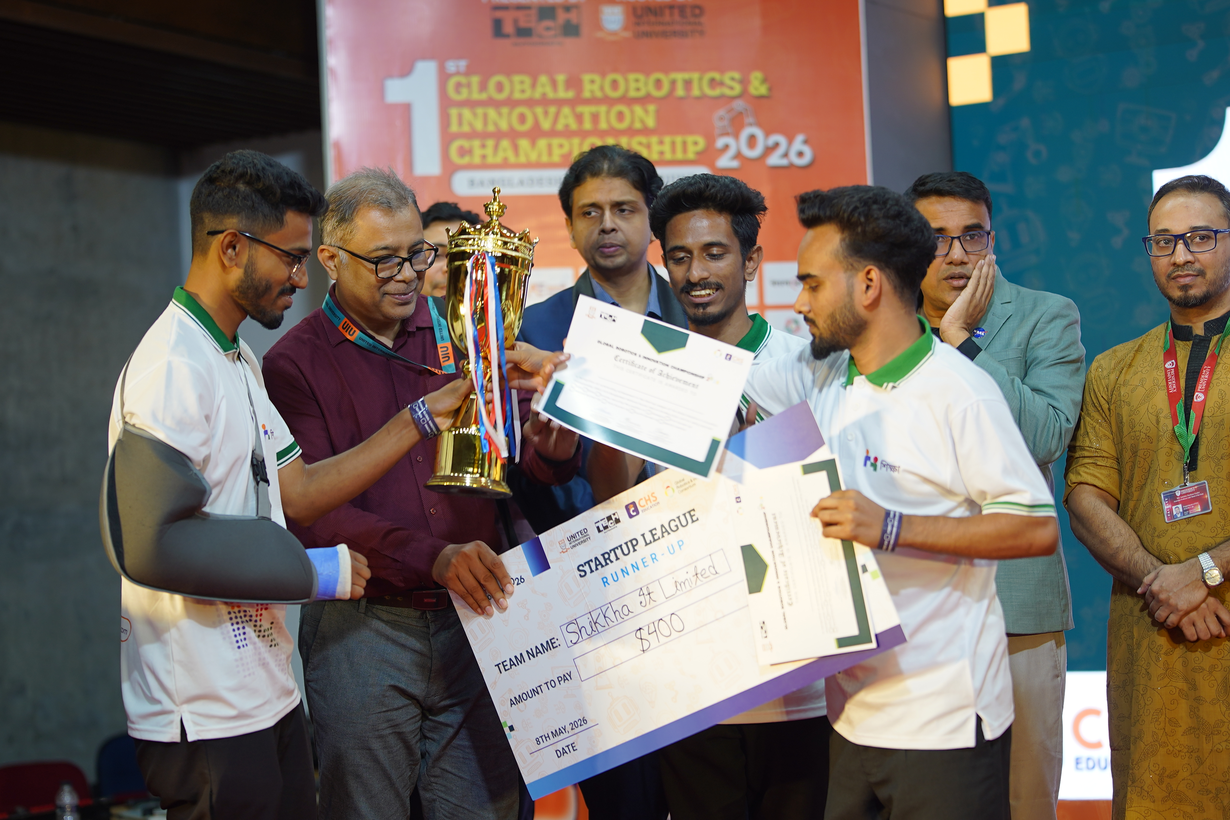 Shikkha IT Limited receiving the trophy and certificate